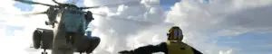 service man watching a helicopter