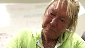 close-up image of a woman with blonde hair at work